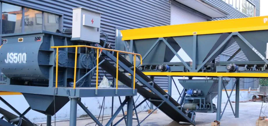 JS500 mixer on its raised platform with the belt conveyor rising to it from the PLD1200 batching station.